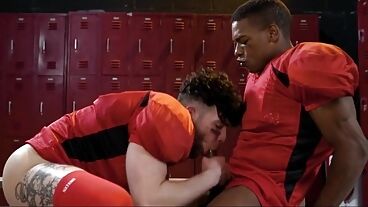 Interracial gay football players lick asses and fuck bareback in locker room