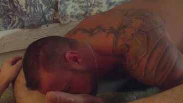 Gorgeous twink is on top of tattooed muscle daddy