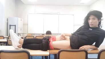 After a hot striptease on the teacher's desk, this horny French-Asian student takes out his dick at school and jerks